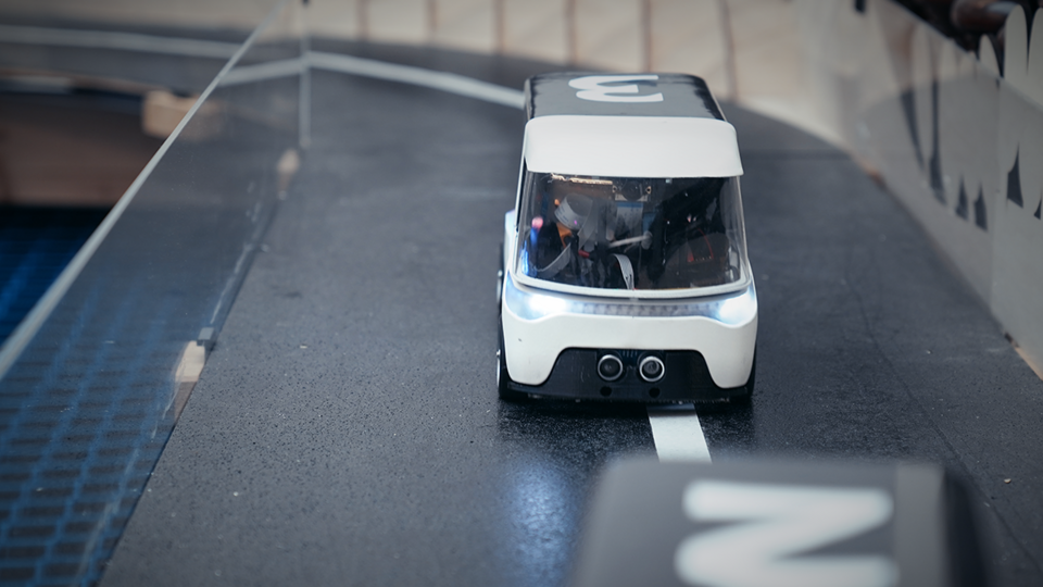 car seen from the front drives on the track