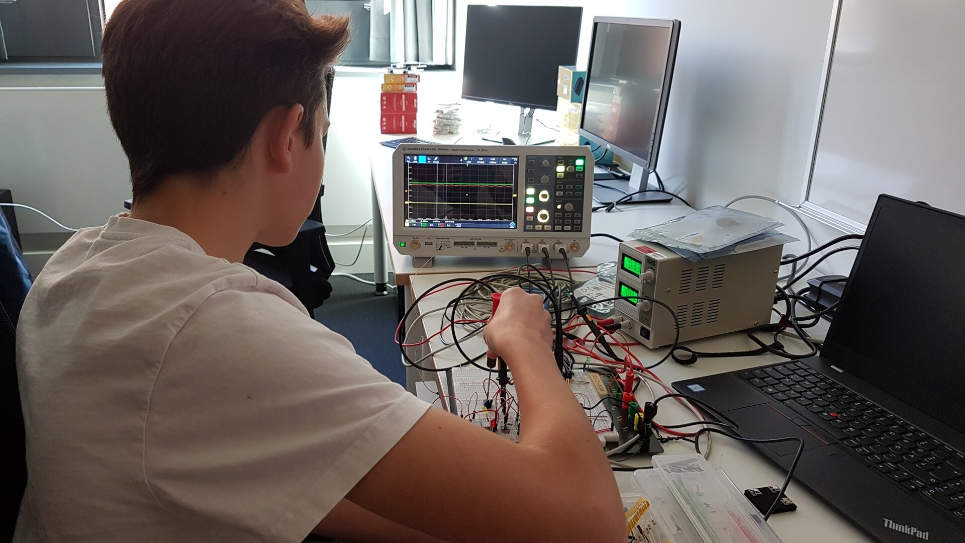 Boy working in robotics lab