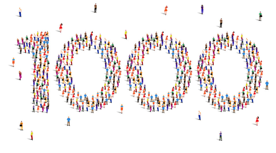 Top view of a lot of drawn people standing next to each other forming the number 1000. the picture has a white background. The people are motley.