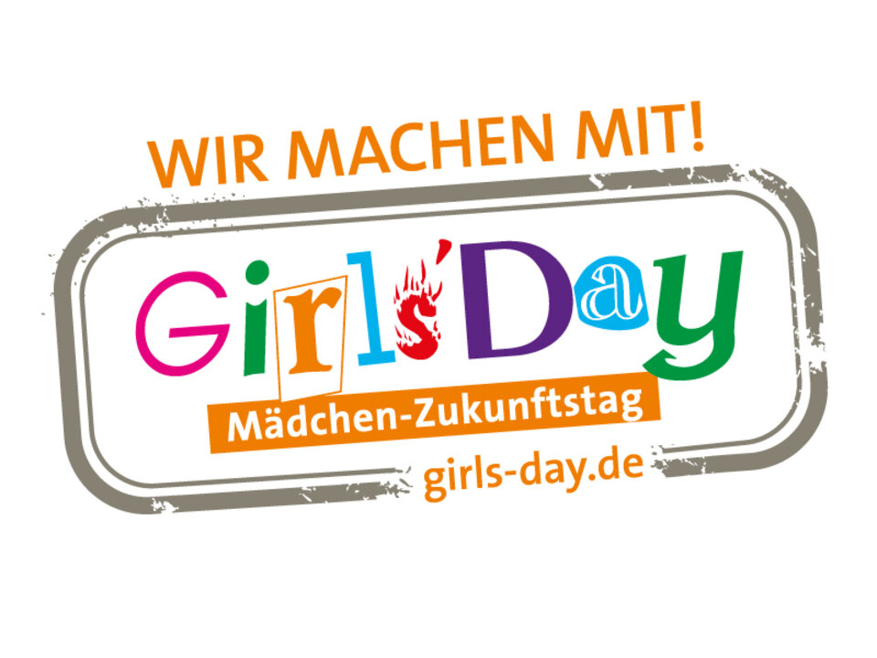 It is a stamp-like looking picture with the following texts: "Wir machen mit"; "Girls'Day. Mädchen Zukunftstag"; girls-say.de